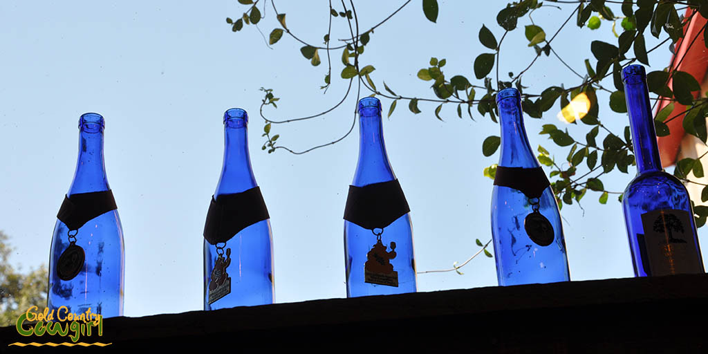 blue-bottles-in-window