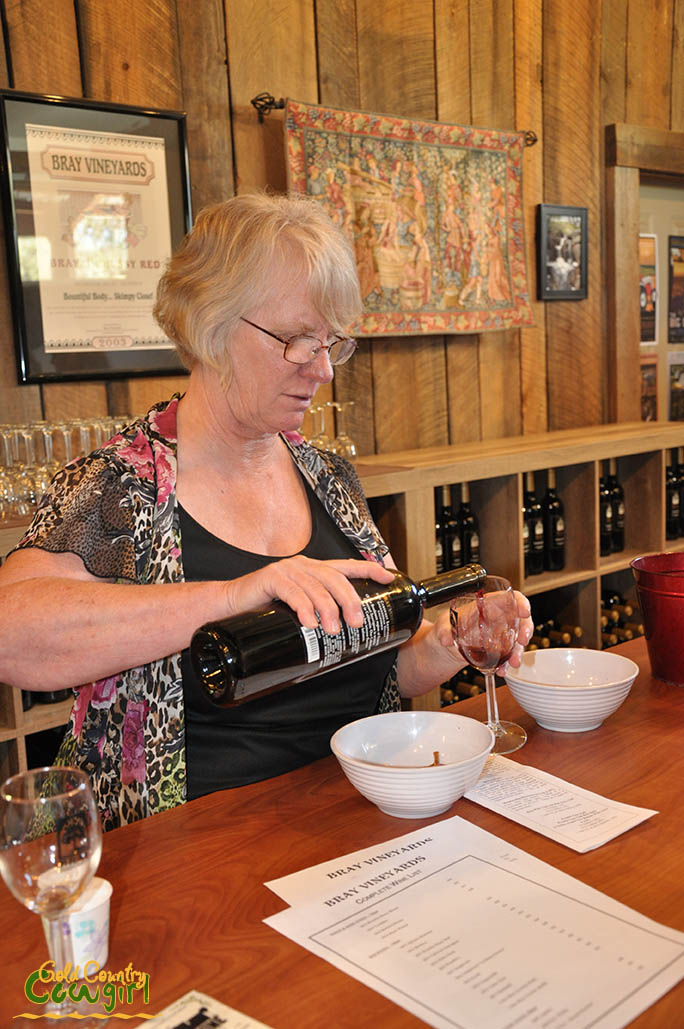 Kathy pouring wine