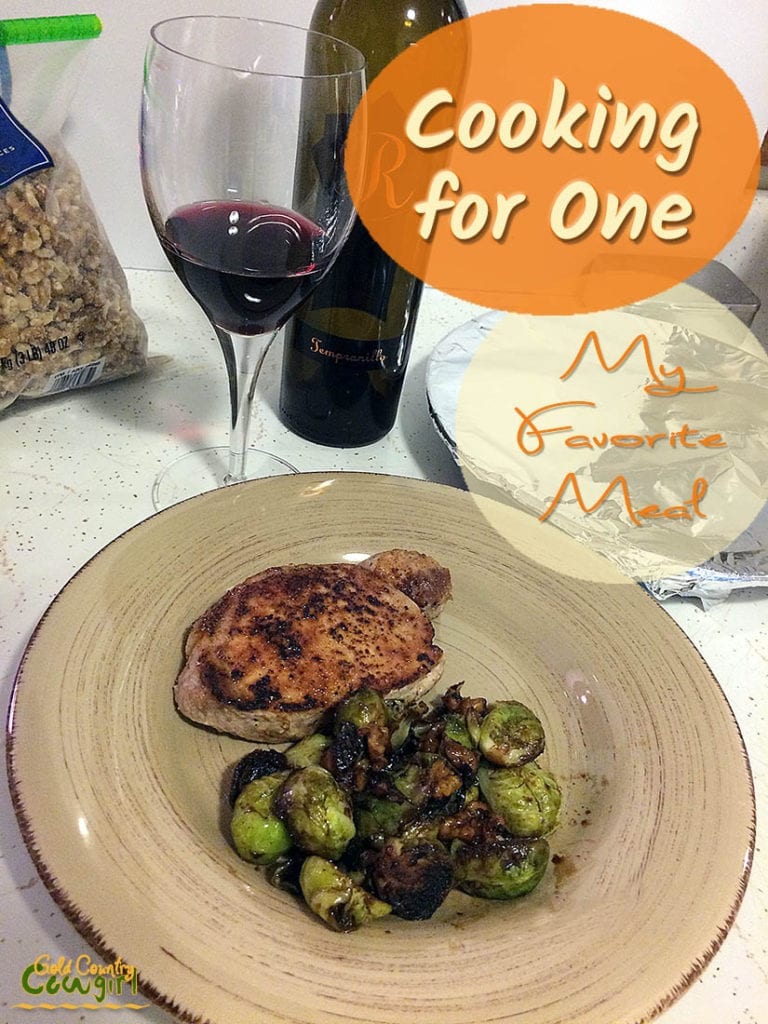 pork chop with brussels sprouts and a glass of wine with text overlay: Cooking for one My Favorite Meal