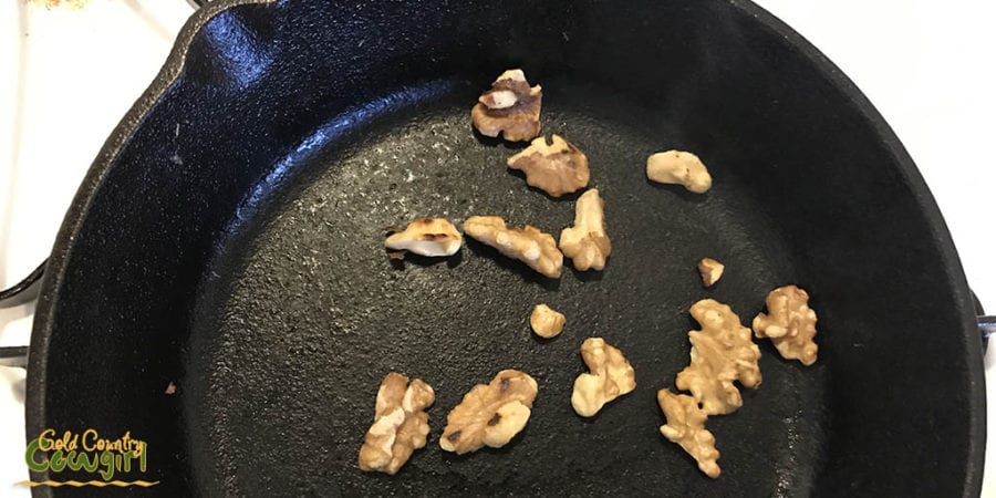 Walnuts toasting in skillet