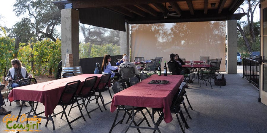 Outdoor patio has screens to block breeze when necessary