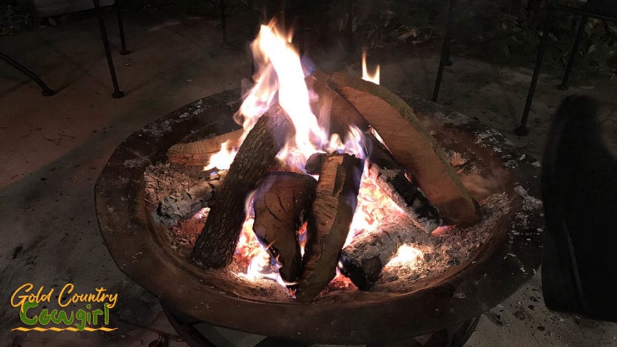 Michael keeps the fire pit stoked when it is cold