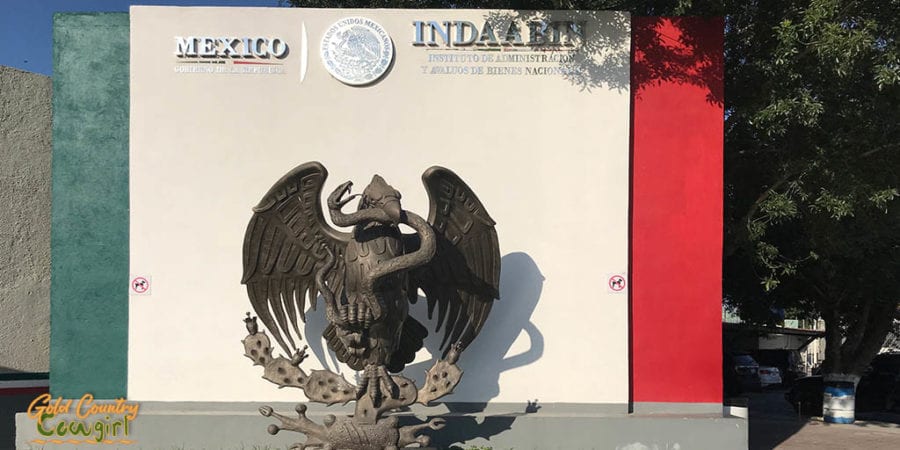 Mexico sign with sculpture of eagle with snake in its beak