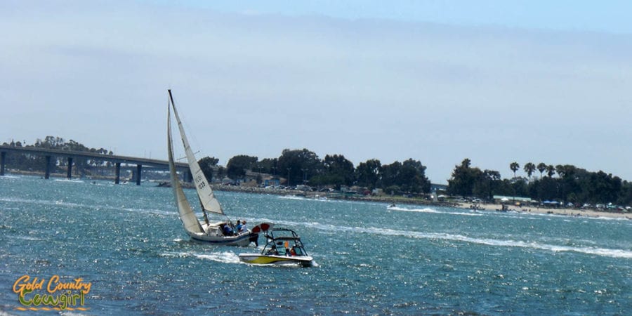 Sail boat and power boat on the water