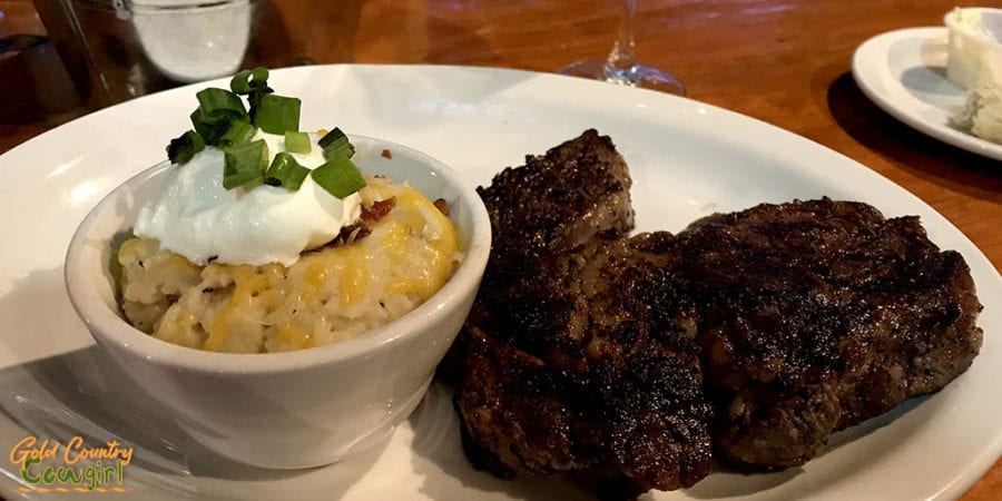 Ribeye and loaded potatoes at Apache Pass Steakhouse