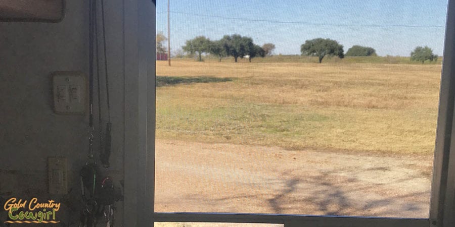 View out trailer door across field