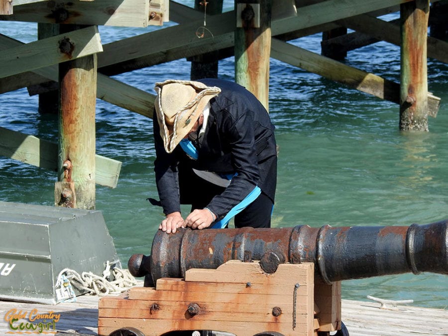 pirate putting fuse in cannon