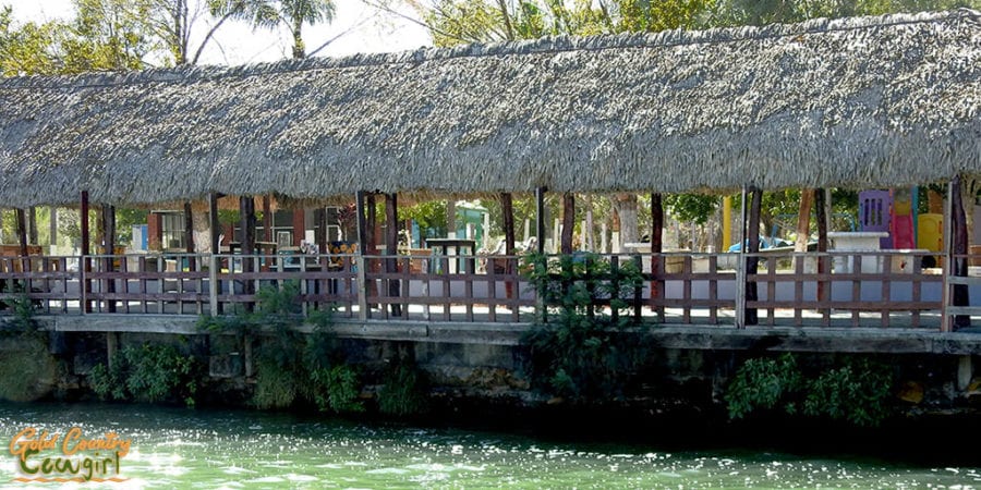 outdoor seating area with thatched roof