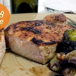 pork chop and brussels sprout dinner with text overlay: Cooking for One My Favorite Meal