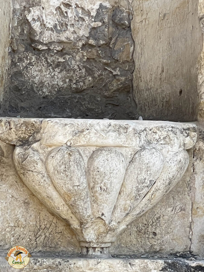 divot in limestone wall from Mexican musket ball at the Alamo