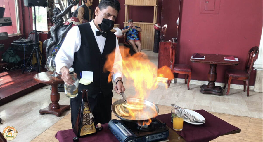 preparing bananas Foster at Angel's, one of the best places to eat in Nuevo Progreso