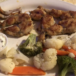 Chuy’s Red Snapper grilled frog legs with veggies