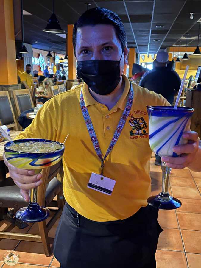 waiter with cocktails at Pancho's Bar, one of the best places to eat in Nuevo Progreso