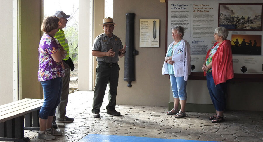 A ranger giving a presentation to a group of tourists.